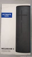 Front of box with Ultimate Ears branding and image of speaker with volume controls