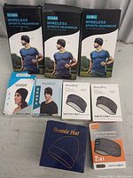 Full lot photo showing all nine sports head band products in their boxes arranged on a flat surface.