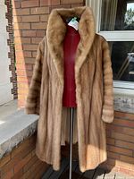 Front view on mannequin showing full coat