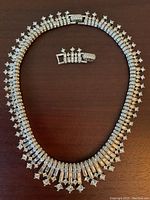 Overhead view of full necklace with detachable extender across top center