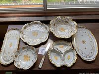 Overview of all six pieces on wood table