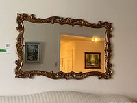 Front view of entire mirror showing frame design and overall condition