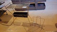 Plant stand showing two tiers, decorative wire, bottom shelf