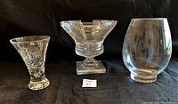 Overview photo showing three crystal vases: pinwheel cut vase, art deco pedestal vase, and 1980s clear glass vase.