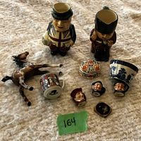 Photo showing entire collection arranged together including two large Toby mugs, reclining horse figurine, mini Toby mugs, small oval trinket box, and bowl.