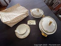 Overall lot including all three Theodore Haviland porcelain items and soft fabric case displayed on table