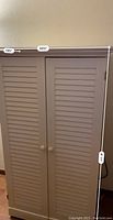 Front view of closed hutch with measurement overlay showing width and depth