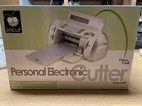 Front of Cricut Personal Electronic Cutter box showing image of machine and branding