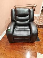 Front view of black leather recliner armchair