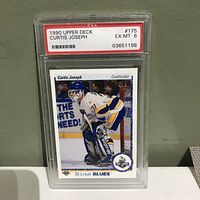 Front view of 1990 Upper Deck Curtis Joseph hockey card in PSA graded case showing player image and grade EX-MT 6.