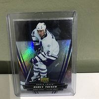 Upper Deck hockey card of Darcy Tucker in Toronto Maple Leafs uniform with holographic design, inside plastic protective case.