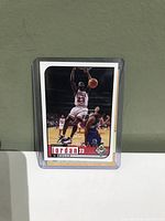 Front side of the first Michael Jordan Chicago Bulls basketball card showing Jordan in mid-air.