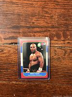 Front of Mike Tyson boxing trading card showing his image in boxing stance with title and heavyweight champion designation.