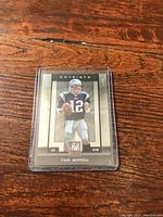 Front of the 2003 Score Tom Brady Patriots rookie card showing player image and information.