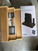 Bamboo kitchen organizer tray with packaging box showing product image and brand Victrola