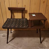 Full view of the wooden mid-century modern phone table with attached seat and geometric patterned cushion.
