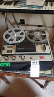 Full view of Sony O Matic reel to reel tape player with reels loaded, showing control panel and brand label.