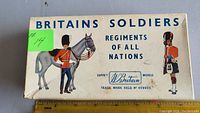 Original Britains Soldiers box with artwork and trademark details, measuring about 8 inches wide