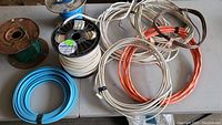 Overview of all coils and spools of electrical wire of various colors and sizes.