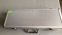 Closed aluminum carrying case for the poker chip set.