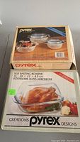 Pyrex brand box showing the 3-piece mixing bowl set with lids and floral pattern.
