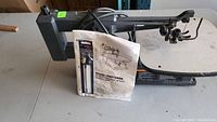 Metal framed 16 inch variable speed Sears Craftsman scroll saw with user manual and Bosch scroll saw blade.