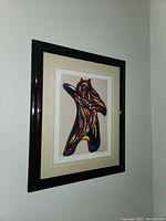 Framed and matted "Bearspirit" art print by Don Chase shown hanging on a wall from an angle.