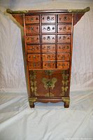 Front view showing overall cabinet form, drawer layout and bottom doors.