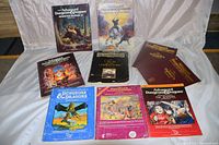 Overview of ten Dungeons & Dragons books and modules displayed on white sheet background.
