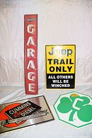 All four metal signs displayed together, showing their size and style.