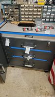 Front view of chest showing three drawers, tubular handles and Black & Decker logo