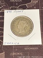 Obverse side of the 1899 Jamaica one penny coin showing Queen Victoria's profile and the year 1899.