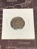 Obverse side of the 1903 US Indian Head one cent coin showing Liberty with Native American headdress and year 1903.