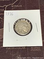 Front of 1936 US Buffalo Nickel showing Native American profile and year.