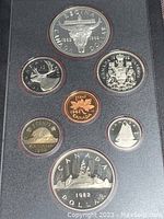 Seven proof coins in black holder displaying Canadian Centennial 1982 designs, including double dollar, dollar, 50c, 25c, 10c, 5c, and 1c coins.