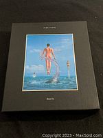 Front cover of the Pink Floyd Shine On box set showing album art of a person emerging from water, in a black hardcover box.