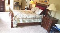 Full assembled bed frame shown with bedding.