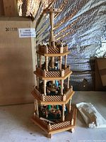 Front angle of the 22 inch multi-tiered wooden German Christmas pyramid with hand-painted figurines and natural wood finish.