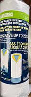 Photo of the rolled fiberglass insulation wrap with label indicating energy savings for water heater insulation.