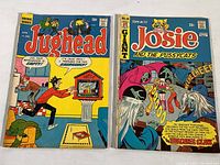 Photo showing cover front of Jughead No. 191 (1971) and Josie and the Pussycats No. 69 (1973) comic books with visible wear and small tears on covers.