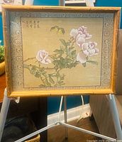 Front view of framed artwork showing pink roses and butterfly with script text.
