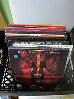 Front view of stacked Laserdiscs including The Devil's Advocate.