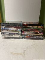 Front view of all 20 DVD cases stacked in two columns showing titles.