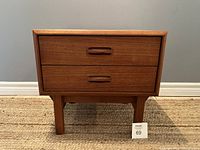 Front view of teak nightstand showing two drawers with integrated handles