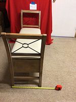 Bench viewed from the side showing metal frame and backrest design.