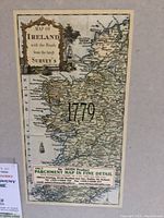 Close-up of smaller Ireland map showing date 1779 and printed details on parchment.