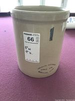Front view of the ceramic crock showing its size label and brand stamp.