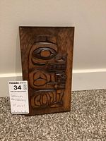 Front view of carving showing Bear and Cub relief carving and overall finish