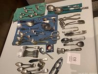 Overview of laid-out utensils on green and blue cloths