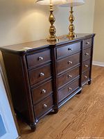 Full frontal view of dresser with lamps (not included) on top.